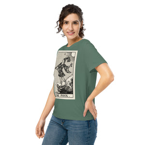 Fitted organic cotton t-shirt featuring The Fool tarot card illustration in high-contrast woodcut rendering.