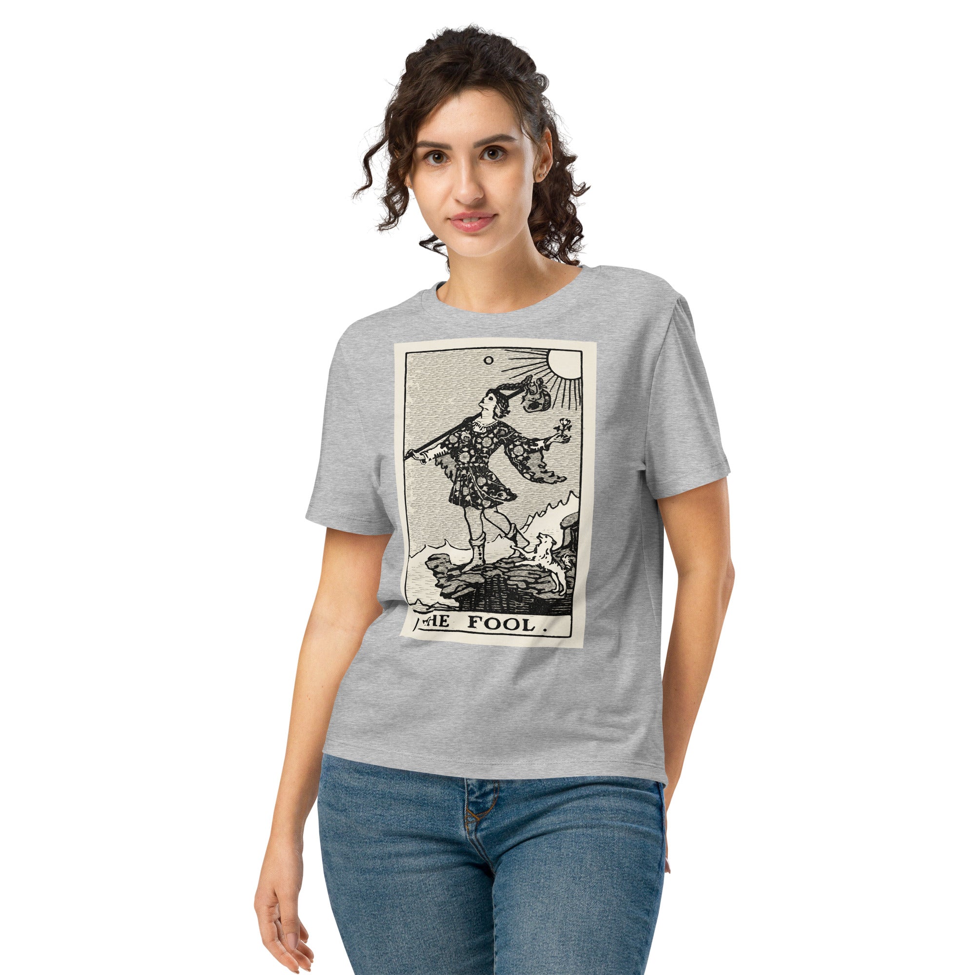 Fitted organic cotton t-shirt featuring The Fool tarot card illustration in high-contrast woodcut rendering.