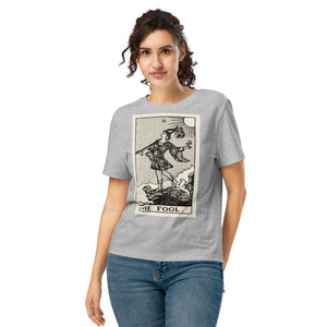 Fitted organic cotton t-shirt featuring The Fool tarot card illustration in high-contrast woodcut rendering.