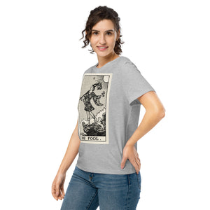 Fitted organic cotton t-shirt featuring The Fool tarot card illustration in high-contrast woodcut rendering.